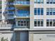 Exterior view of a condominium with balconies and large windows at 5455 Landmark Pl # 407, Greenwood Village, CO 80111