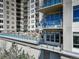 Apartment building with multiple floors and private balconies overlooking pool and lounge areas at 5455 Landmark Pl # 407, Greenwood Village, CO 80111