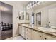 Bright bathroom with double sinks, granite counters, and ample lighting at 822 Shadowstone Dr, Highlands Ranch, CO 80129