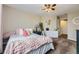 Charming bedroom with plush bedding, a full length mirror, and soft pastel accents creating a soothing and inviting retreat at 822 Shadowstone Dr, Highlands Ranch, CO 80129
