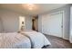 Bedroom featuring a sliding door closet and a view of the ensuite bathroom at 822 Shadowstone Dr, Highlands Ranch, CO 80129