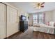 Cozy bedroom with a ceiling fan, closet space, and soft lighting creating a warm and comfortable atmosphere at 822 Shadowstone Dr, Highlands Ranch, CO 80129