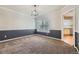 Neutral dining room with carpet and a view to kitchen at 822 Shadowstone Dr, Highlands Ranch, CO 80129