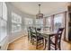 Dining room features a large window, and a wooden dining table at 822 Shadowstone Dr, Highlands Ranch, CO 80129