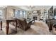 Cozy living room showcasing a brick fireplace, built-in shelves, and comfortable seating at 822 Shadowstone Dr, Highlands Ranch, CO 80129