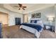 Comfortable main bedroom with tray ceilings, soft natural lighting, and stylish decor for a soothing and inviting atmosphere at 822 Shadowstone Dr, Highlands Ranch, CO 80129