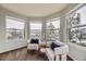Bright and cozy sitting area with views of snow covered trees. Perfect spot for relaxation and unwinding in comfort at 822 Shadowstone Dr, Highlands Ranch, CO 80129