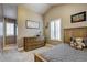 Comfortable bedroom features a vaulted ceiling, shutters, neutral colors, and a cozy bed at 3440 W 33Rd Ave, Denver, CO 80211