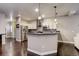 Bright kitchen showcasing stainless steel appliances, granite countertops, and a breakfast bar at 3440 W 33Rd Ave, Denver, CO 80211