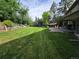 Large backyard featuring mature trees, a covered patio, and a gazebo at 7290 S Cook Cir, Centennial, CO 80122