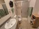 Bathroom featuring a shower with glass doors and a light wood vanity at 7290 S Cook Cir, Centennial, CO 80122