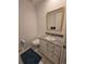Small powder room with granite countertop and modern fixtures at 7290 S Cook Cir, Centennial, CO 80122