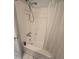 Standard bathtub with a shower head and a white shower curtain in a bathroom at 7290 S Cook Cir, Centennial, CO 80122