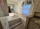 Relaxing soaking tub complete with jets, tile surround, and great light at 7290 S Cook Cir, Centennial, CO 80122