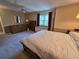 Spacious bedroom featuring a ceiling fan, neutral paint, and carpet at 7290 S Cook Cir, Centennial, CO 80122