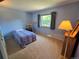 Bedroom features neutral paint, carpet, and a bright window at 7290 S Cook Cir, Centennial, CO 80122