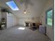 Bonus room offers skylight, vaulted ceiling, neutral paint and carpet at 7290 S Cook Cir, Centennial, CO 80122