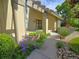 Charming home featuring a decorative pergola, brick planter, and vibrant landscaping, creating welcoming curb appeal at 7290 S Cook Cir, Centennial, CO 80122