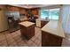 Charming eat-in kitchen features stainless steel appliances and large countertops at 7290 S Cook Cir, Centennial, CO 80122