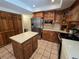 Traditional eat-in kitchen boasts stainless appliances, an island, and generous counter space at 7290 S Cook Cir, Centennial, CO 80122