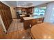 Bright eat-in kitchen with ample counter space adjoins dining and living areas at 7290 S Cook Cir, Centennial, CO 80122