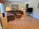 Comfortable living room boasts gleaming hardwood floors and lots of natural light at 7290 S Cook Cir, Centennial, CO 80122