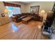 Cozy living room featuring hardwood floors, a large window, and comfortable furniture at 7290 S Cook Cir, Centennial, CO 80122