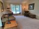 Comfortable living room featuring a large window with a window seat and seating area at 7290 S Cook Cir, Centennial, CO 80122