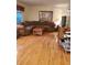 Hardwood floors, comfy couch, and television in the living room at 7290 S Cook Cir, Centennial, CO 80122