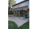 Covered patio with outdoor seating and a grill, perfect for entertaining guests at 7290 S Cook Cir, Centennial, CO 80122