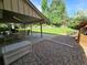 Relaxing covered patio with outdoor seating, adjacent to a well-kept yard, perfect for enjoying the outdoors at 7290 S Cook Cir, Centennial, CO 80122
