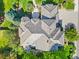 Aerial view of an impeccably maintained home with a multi-toned roof and a beautifully landscaped yard at 5350 S Marshall St, Littleton, CO 80123