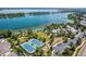 Aerial view of the community tennis courts, pool, clubhouse, and lake, offering a range of recreational amenities at 5350 S Marshall St, Littleton, CO 80123