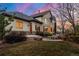 Back exterior view of home with a manicured lawn and patio offers outdoor enjoyment at 5350 S Marshall St, Littleton, CO 80123