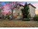 Back exterior view of home highlighting a well-manicured lawn and mature landscaping at 5350 S Marshall St, Littleton, CO 80123
