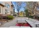 Expansive backyard featuring mature trees, landscaping, and an outdoor seating area at 5350 S Marshall St, Littleton, CO 80123