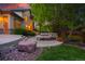 Expansive backyard with lush landscaping and a comfortable seating area for entertaining at 5350 S Marshall St, Littleton, CO 80123