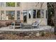 Outdoor patio area with modern seating around a fire pit provides a relaxing retreat at 5350 S Marshall St, Littleton, CO 80123