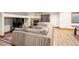Cozy basement living room with fireplace and large sectional sofa provides ample seating at 5350 S Marshall St, Littleton, CO 80123