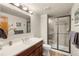 Renovated bathroom features modern fixtures, glass enclosed shower, and attractive vanity at 5350 S Marshall St, Littleton, CO 80123