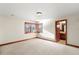 Bright and airy bedroom featuring wooden floors and window casings with an ensuite bathroom at 5350 S Marshall St, Littleton, CO 80123