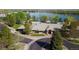 Scenic aerial view of the clubhouse, pool, and lake, offering a community with many opportunities for enjoyment and recreation at 5350 S Marshall St, Littleton, CO 80123