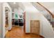 Bright entryway with hardwood floors and staircase leading to the second level at 5350 S Marshall St, Littleton, CO 80123