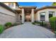 Inviting front entrance with a landscaped walkway, stone pillars, and a solid wood door, radiating curb appeal at 5350 S Marshall St, Littleton, CO 80123