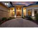 Inviting front entrance with stone pillars, manicured landscaping, and a charming walkway to the front door at 5350 S Marshall St, Littleton, CO 80123