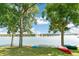 Beautiful lake scene with kayaks and canoes near the waterfront surrounded by lush trees, ready for outdoor adventures at 5350 S Marshall St, Littleton, CO 80123