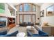 Bright living room with vaulted ceilings, fireplace, and large windows, offering a comfortable and stylish gathering space at 5350 S Marshall St, Littleton, CO 80123