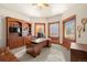 Home office featuring a large built-in bookshelf, desk, big windows, and plenty of natural light at 5350 S Marshall St, Littleton, CO 80123