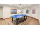 Basement recreation room with a ping pong table and overhead lighting at 5350 S Marshall St, Littleton, CO 80123