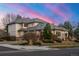 Beautiful side exterior of home with tidy landscaping, mature trees, and an attached three-car garage at 5350 S Marshall St, Littleton, CO 80123